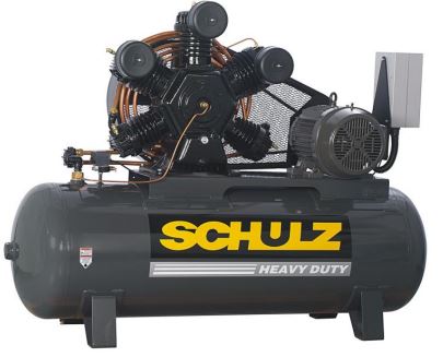 How does the enclosed belt guard benefit the air compressor?